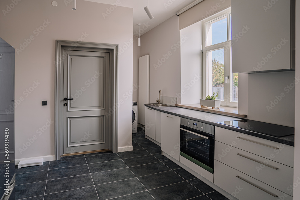 White and brown modern kitchen with wooden island White and brown modern kitchen with wooden island