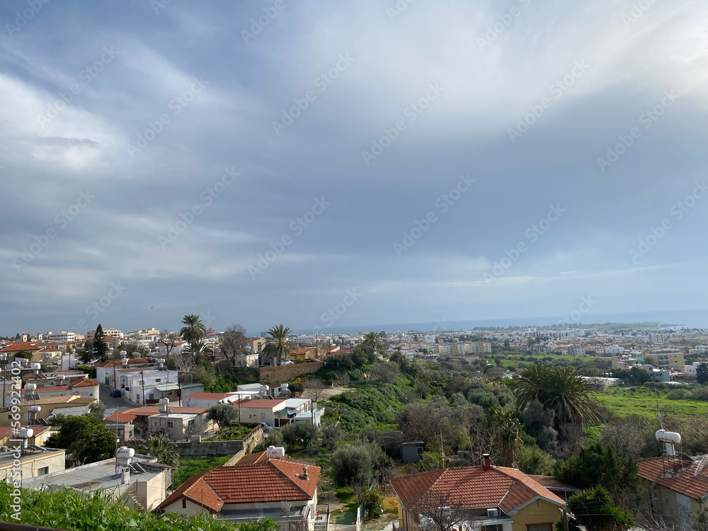 View of a small Mediterranean town from a hill. Cyprus, March 2022.