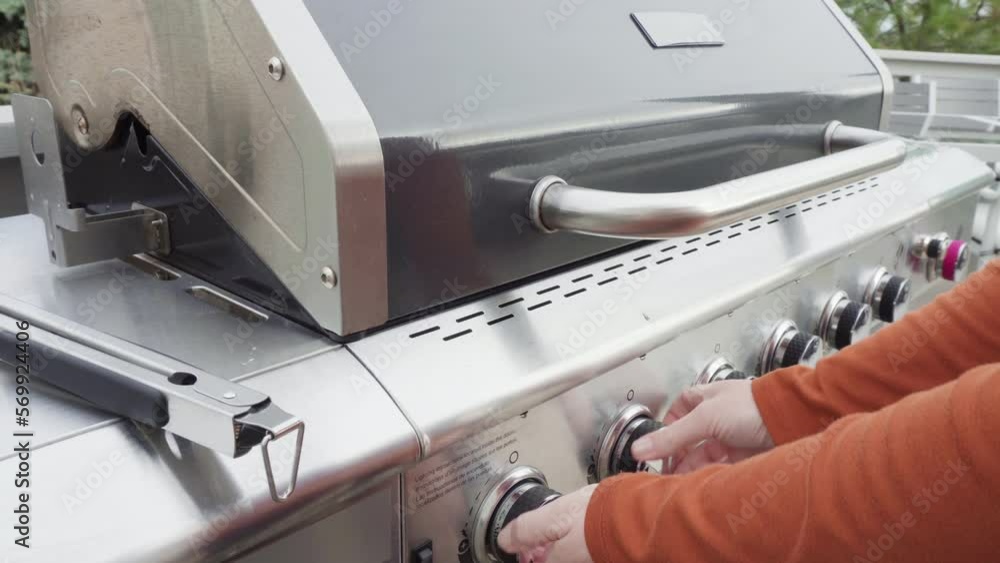 Cooking bacon stips on an outdoor gas grill. Cooking bacon stips on an outdoor gas grill.