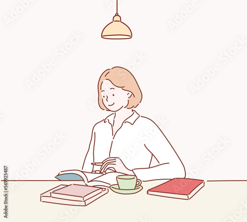 Smiling young woman studying at the table. Hand drawn style vector design illustrations.