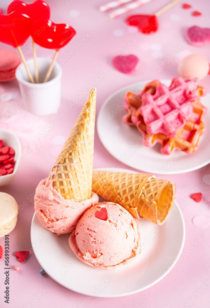 Pink ice cream cones with red sugar hearts shaped sprinkles. Valentines day concept. Pink ice cream cones with red sugar hearts shaped sprinkles. Valentines day concept.