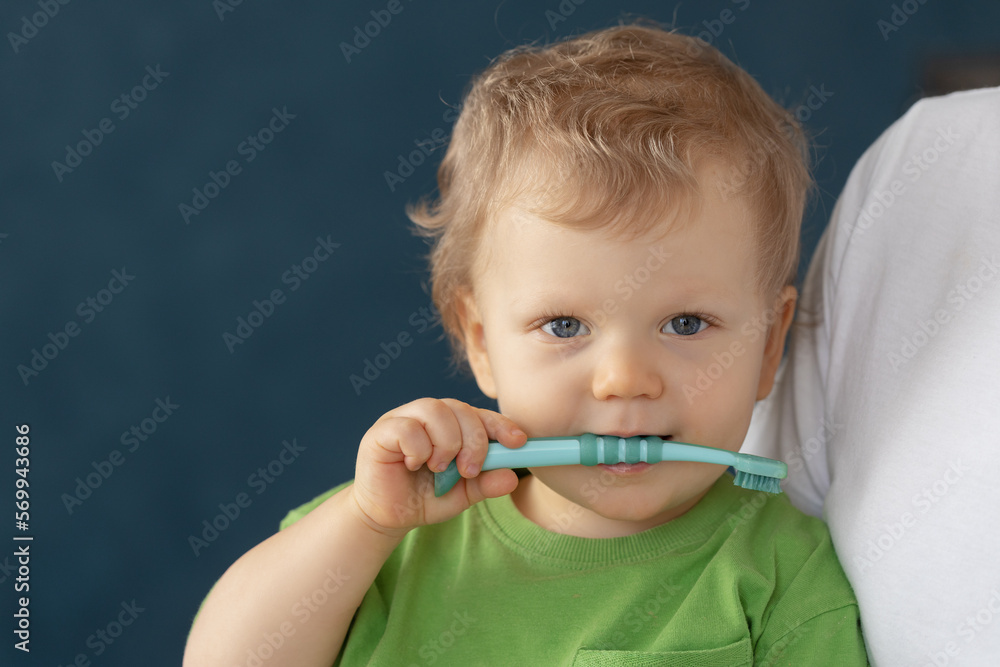 Cute baby 2 years old brushes his teeth with a toothbrush. The concept of oral hygiene and healthy teeth from infancy. Cute baby 2 years old brushes his teeth with a toothbrush. The concept of oral hygiene and healthy teeth from infancy.
