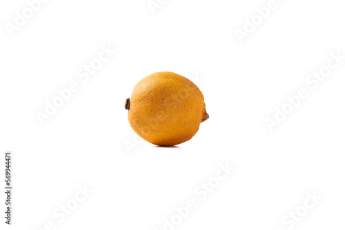 A dried up lemon on a transparent background. Rotten citrus fruit shown isolated. The lemon peel is wrinkled.