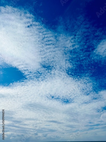 Blue sky with clouds vertical background