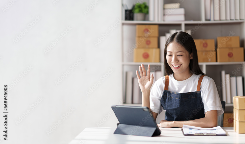 successful woman SME business with parcel boxes in her own job shopping online business at home office. successful woman SME business with parcel boxes in her own job shopping online business at home office.