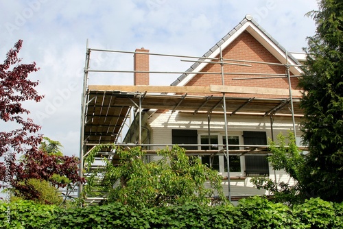 Outside house renovation and scaffold tower