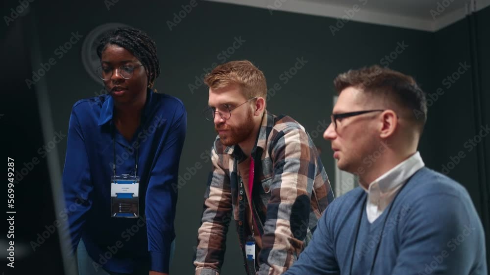 multiethnic team of software designers or data analysts solving problem and discussing project