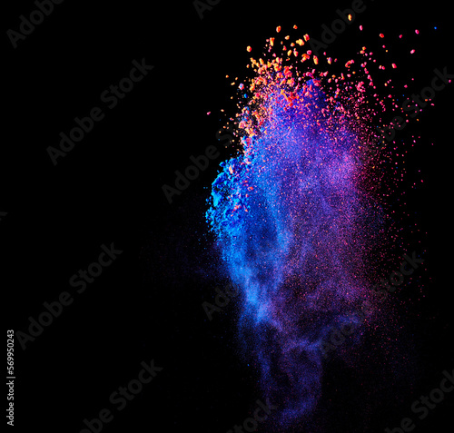 Flying holi powder paint explosion over black abstract background