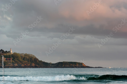 Cap Higer lighthouse near Hendaye city in the Basque coast photo