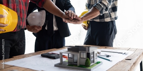 Tableau sur toile Engineer team to join hands together, accept agree cooperation and success conce