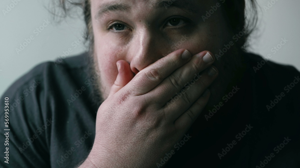 Preoccupied man suffering from mental pain. Close up face of a worried person with anxious expression. Emotional disorder concept Preoccupied man suffering from mental pain. Close up face of a worried person with anxious expression. Emotional disorder concept