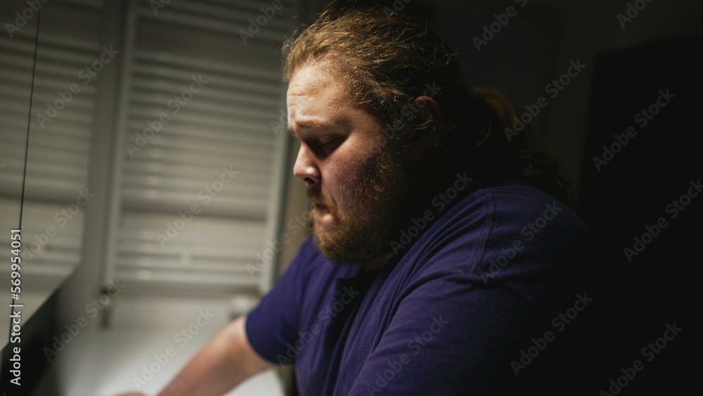 Fototapeta premium One desperate young man suffering from stress in front of mirror reflection. Person having mental pressure overwhelmed by problems and modern life