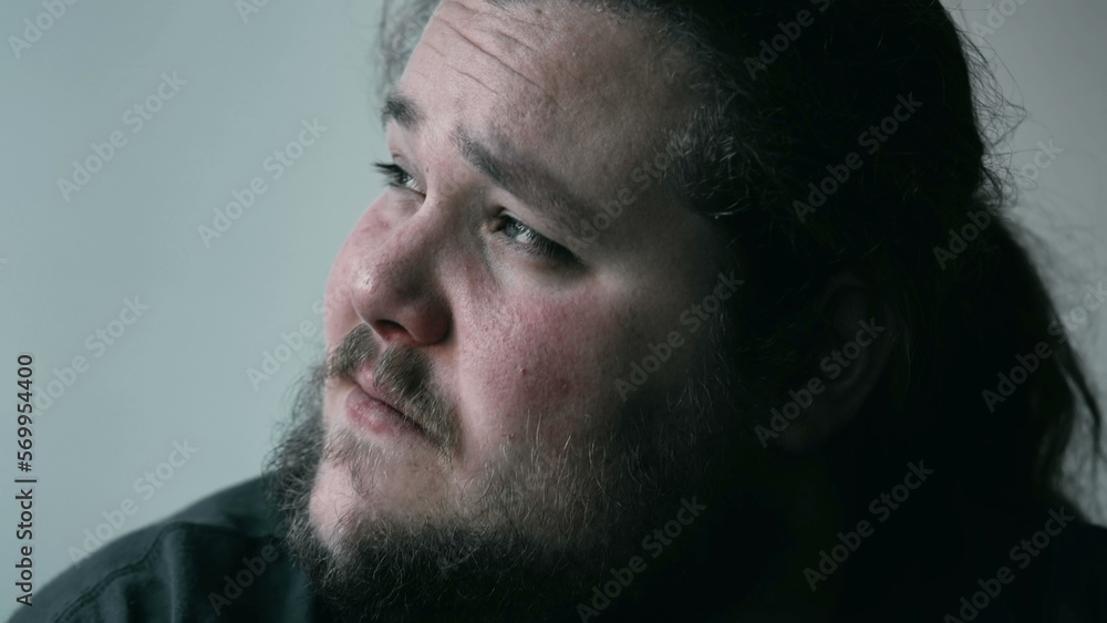 Desperate man crying in despair covering face in shame and regret. Person suffering from emotional pain. Depression concept Desperate man crying in despair covering face in shame and regret. Person suffering from emotional pain. Depression concept