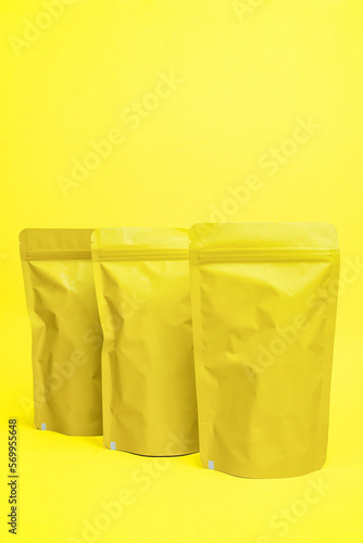 Yellow snack packaging mock-up isolated on yellow background.
