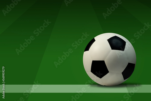 Soccer ball on green grass with copy space for text.