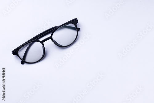Glasses with transparent lenses are on a white background.
