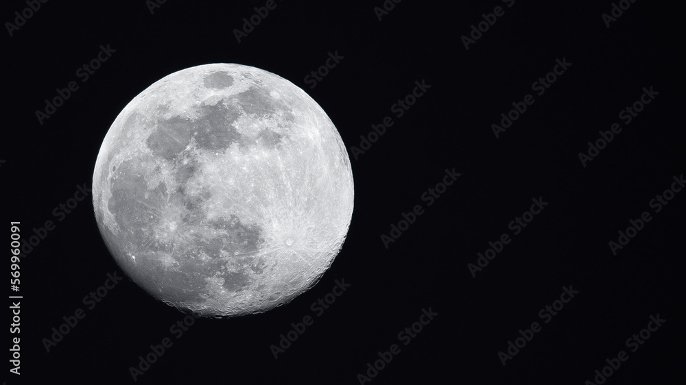 Horizontal photo of full moon showing meteor craters on a black background with copy space Horizontal photo of full moon showing meteor craters on a black background with copy space