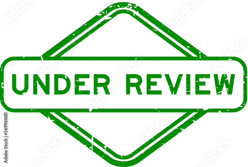 Grunge green under review word rubber seal stamp on white background