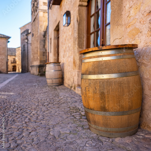 Wooden barrel to store wine in the narrow streets of the medieval village of Pedraza, Segovia.