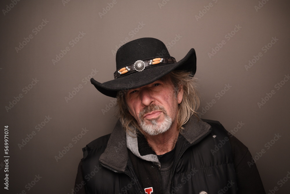 portrait of man in black cowboy hat portrait of man in black cowboy hat