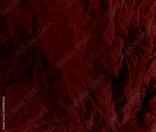 Old and grainy and grunge red crumpled paper background, Abstract wrinkled or Free photo crumpled red paperboard or empty canvas or paper surface or fabric stain background. 