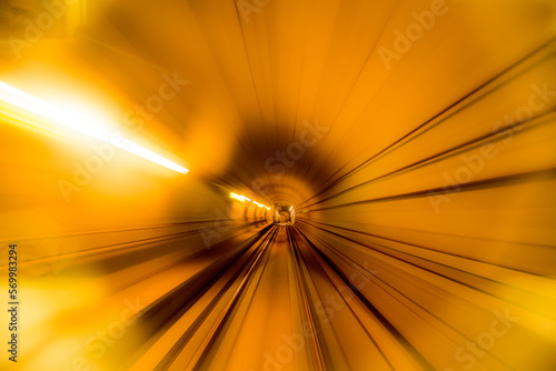 Abstract image of motion blurred tracks, tunnel and glass subway doors in Copenhagen, Denmark.
