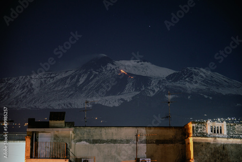 Foto della colata lavica, sul vulcano Etna, vista da Riposto, paese siciliano photo