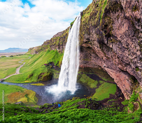 Obraz na płótnie Charming beautiful waterfall Seljalandsfoss in Iceland. Exotic countries. Amazing places. Popular tourist atraction. w salonie