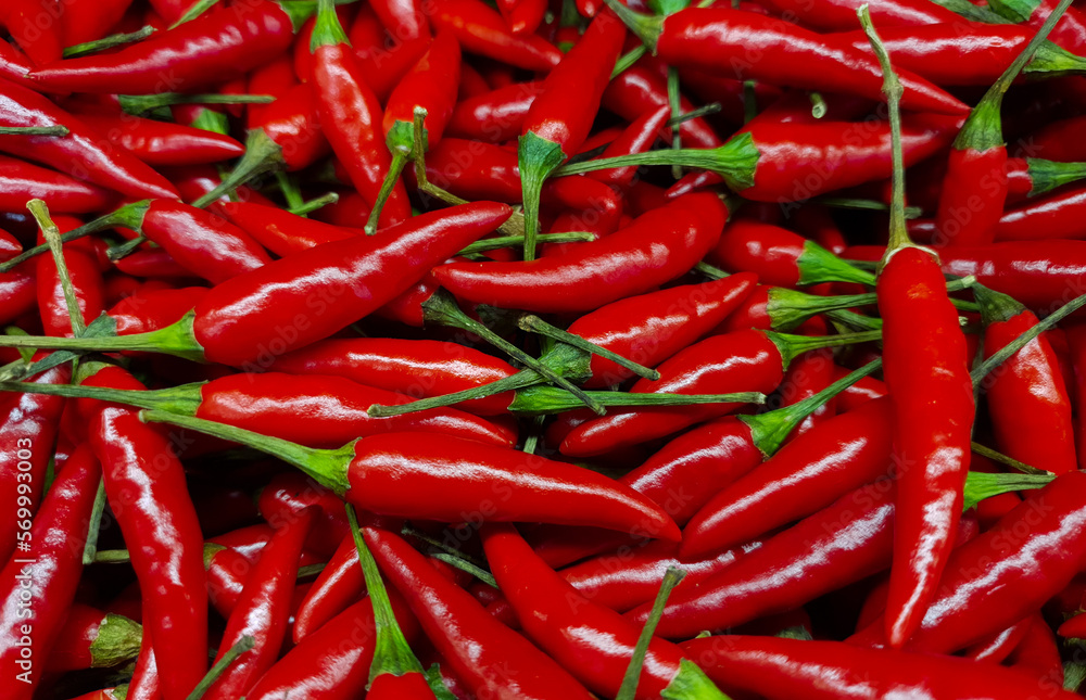 Many red hot chili peppers in market