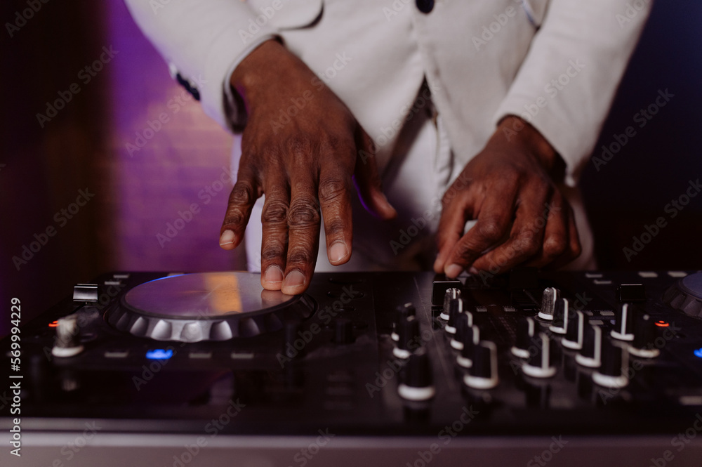 hands control the remote control. setting the remote control knob. electronic device of the mixer console. hands control the remote control. setting the remote control knob. electronic device of the mixer console.