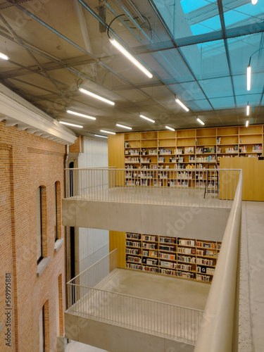 inside a public library, view on two floors with bookshelves