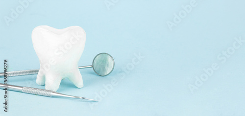 Tooth model in heart shape and Dentist Professional tools medical equipment  teeth will good healthy.