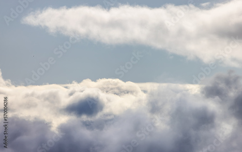 Fototapeta Naklejka Na Ścianę i Meble -  Aerial View of White Puffy Cloudscape in British Columbia, Canada. Nature Background