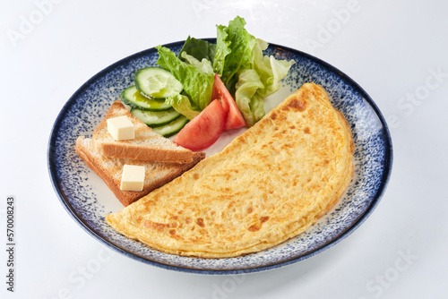 omelet with toasts and vegetables
