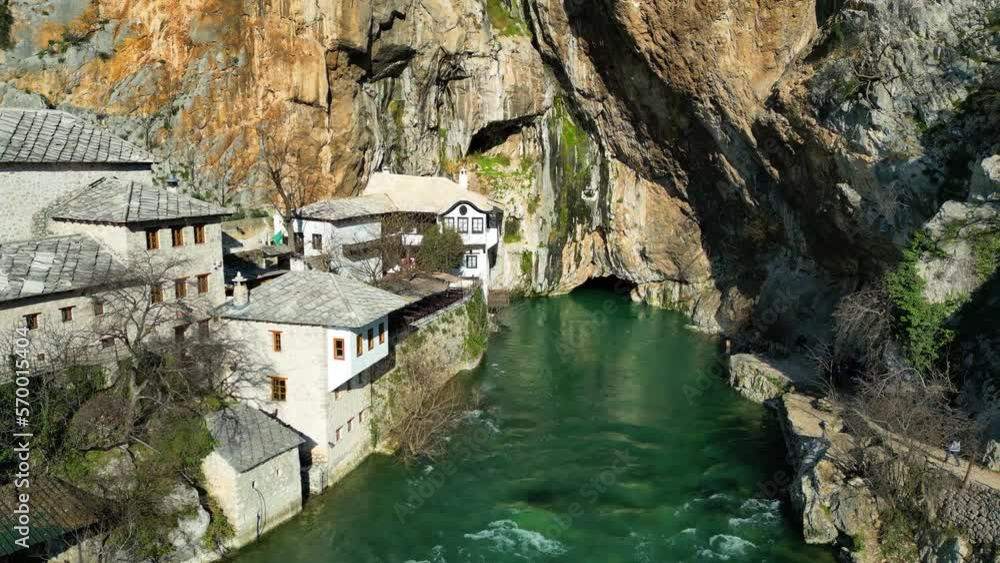 Aerial drone view of Tekija in Blagaj in BiH. The Tekija, dervish house, set at the source of the river Buna, was and still is a venue for dervish Zikr praise-chanting three nights weekly. Aerial drone view of Tekija in Blagaj in BiH. The Tekija, dervish house, set at the source of the river Buna, was and still is a venue for dervish Zikr praise-chanting three nights weekly.