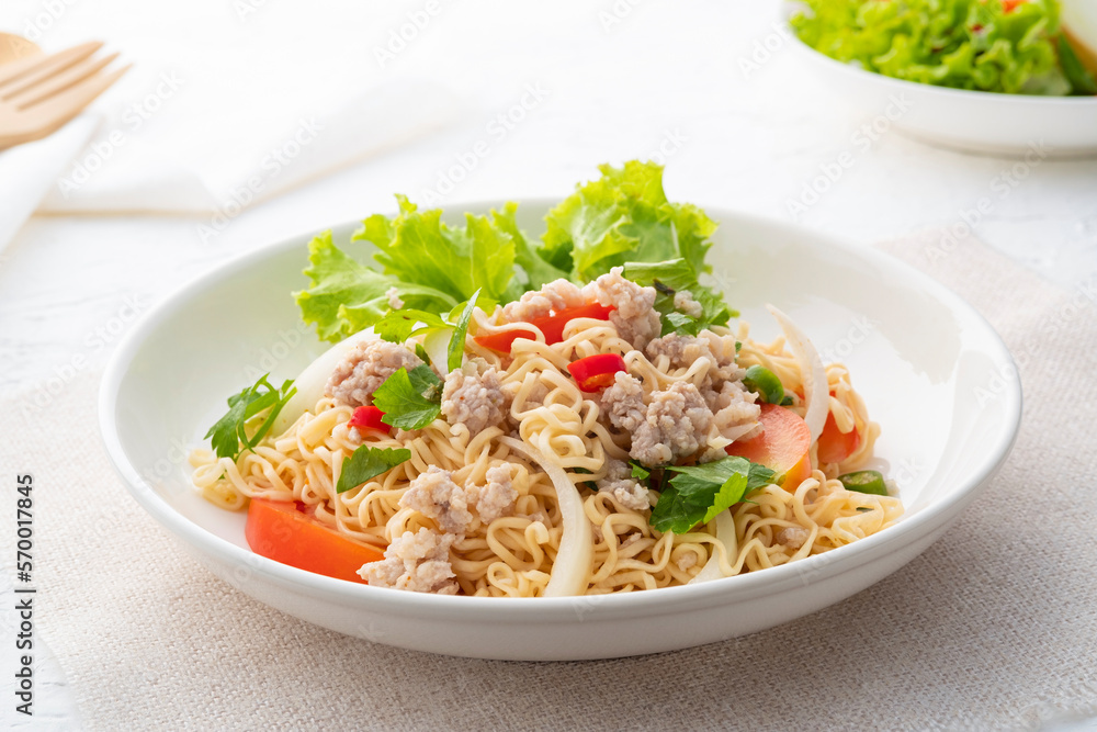 instant noodle spicy salad.Thai hot and sour noodle salad with minced pork that is very flavorful and addictive