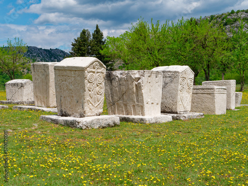 Stecci Medieval Tombstones Graveyards in Radimlja, Bosnia and Herzegovina. Unesco site. Historic place of interest. The tombstones feature a wide range of decorative motifs and inscriptions. photo