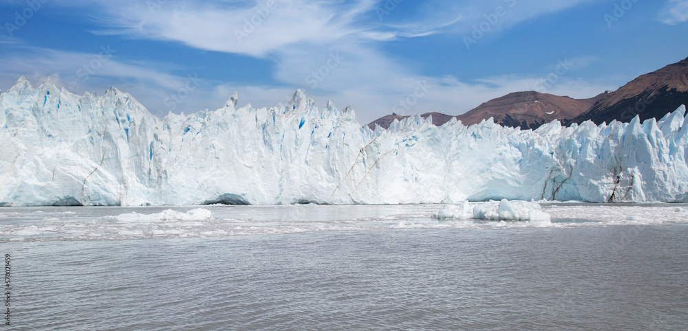 Glacier landscape with ice texture, mountain and frozen lake