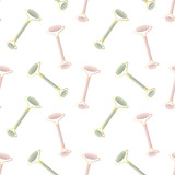 Seamless vector pattern with jade and quartz rollers. Vector background with cosmetic tools.