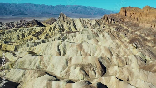 Aerial view of people walking on the mountain crest at Zabriskie point, Death Valley, United States.