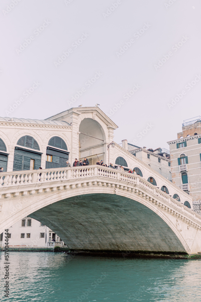 
The Rialto Bridge is a magical place and regularly attracts people from all over the world. Summer is in the air and the white stone reflects in the blue water.