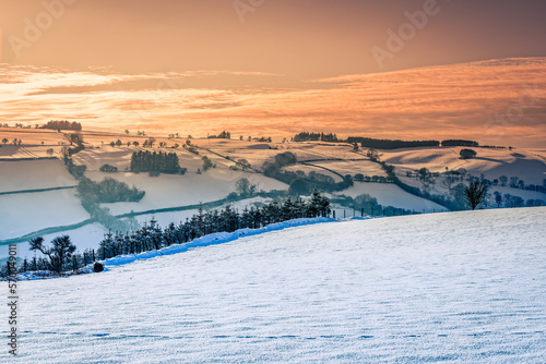 A winter sunset in the snow covered Brecon Beacons.