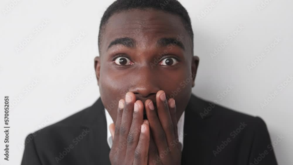 Shock news. Embarrassed businessman. Work mistake. Portrait of surprised man feeling afraid of job trouble posing on white studio background. Shock news. Embarrassed businessman. Work mistake. Portrait of surprised man feeling afraid of job trouble posing on white studio background.