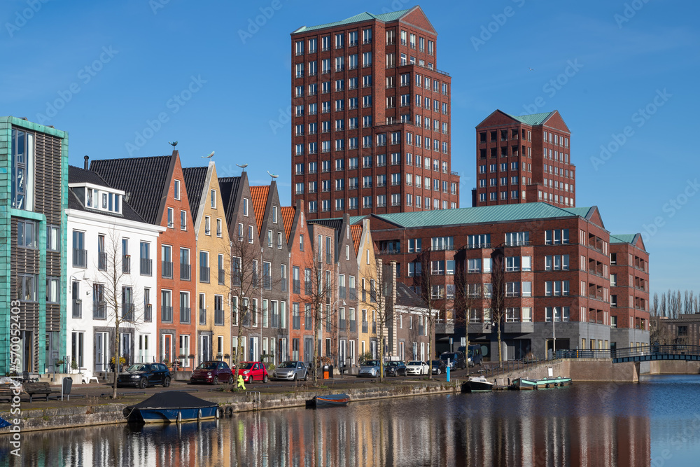 New modern residential buildings along the canal in the Vathorst district in Amersfoort in the Netherlands.