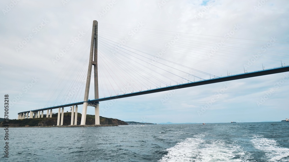 Fototapeta premium Vladivotok bridge. View from the moving ferry.