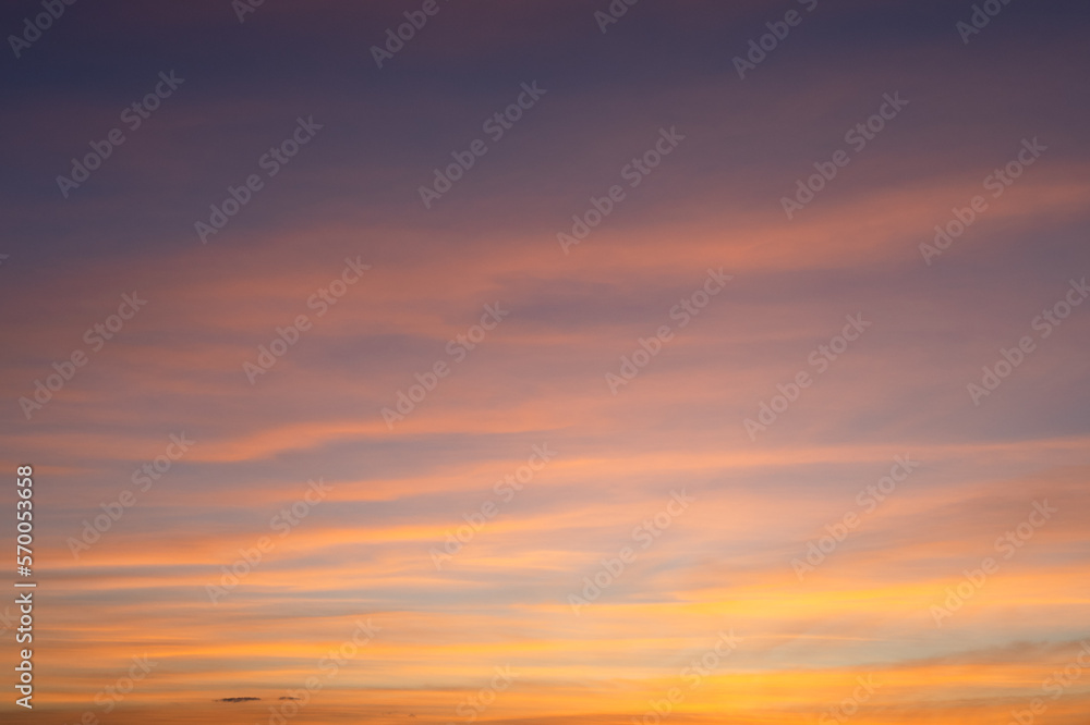 Cloudscape at golden hour after sunset, pink orange colors.