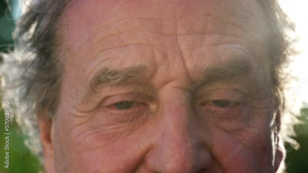 One mature senior man SHOCK reaction. Macro close up eyes of older mature person surprise expression outside One mature senior man SHOCK reaction. Macro close up eyes of older mature person surprise expression outside