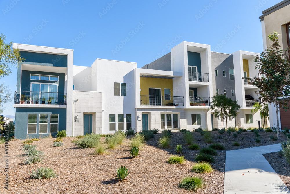 Newly built row houses in a housing development in California on a clear autumn day