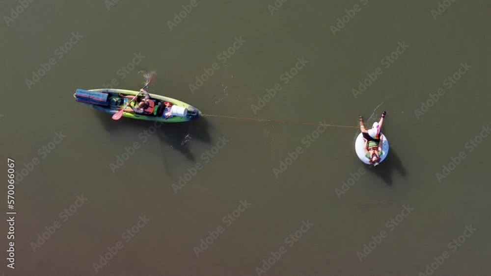 Sea of Galilee, Israel - 4 November 2022: Aerial view of people kayaking in a lake. Sea of Galilee, Israel - 4 November 2022: Aerial view of people kayaking in a lake.