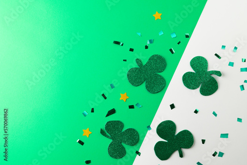 Image of green clover and copy space on white and green background
